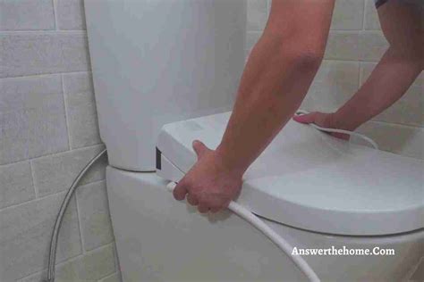 how to remove a toto toilet seat